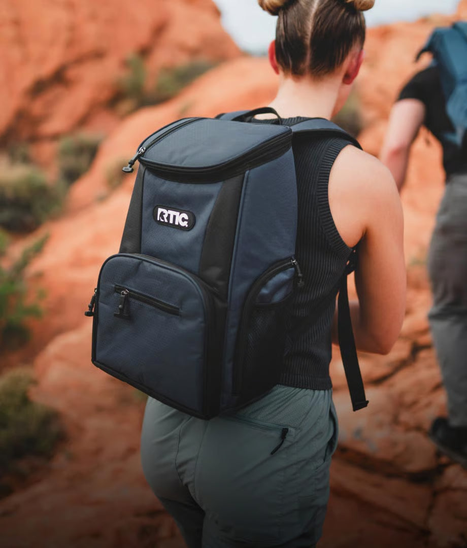 Hiker wearing a backpack cooler